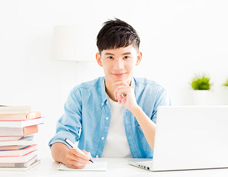 student sitting at desk – school placement services